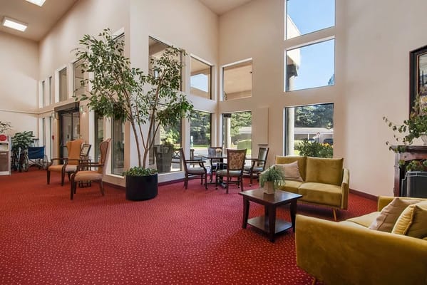 Lounge area with seating and large windows in Solista Gresham