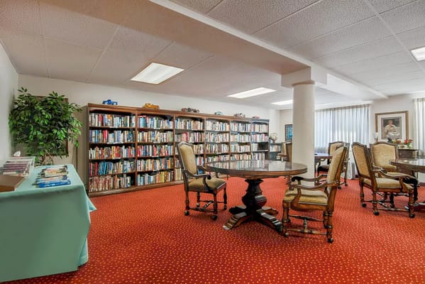 Cozy library with bookshelves and seating area