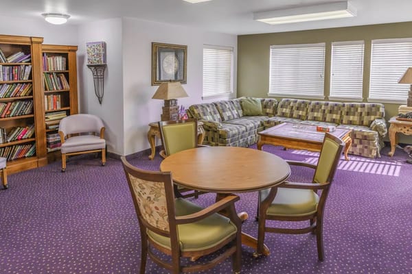 Common area with seating and a bookshelf