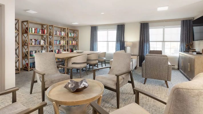 Interior common area with seating and bookshelves