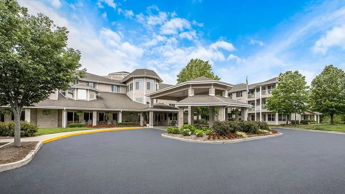 Exterior view of Holiday Redbud Hills with landscaped entrance