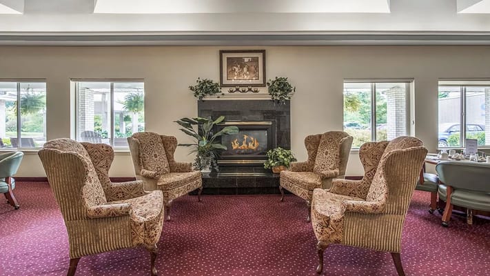 Cozy common area with armchairs and fireplace