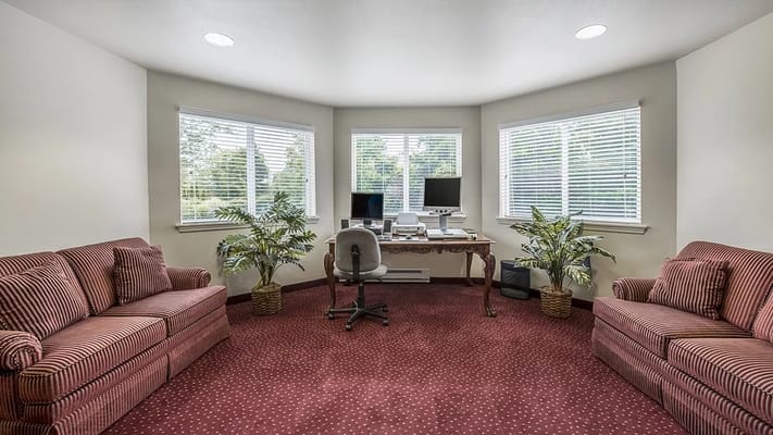 A clean and bright interior space with seating