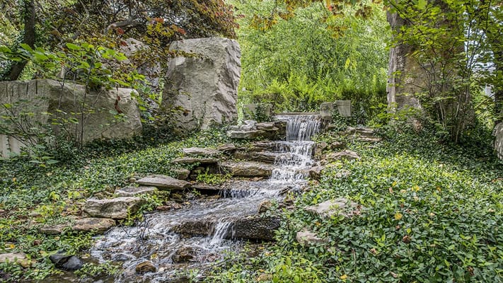Small waterfall in a landscaped garden area