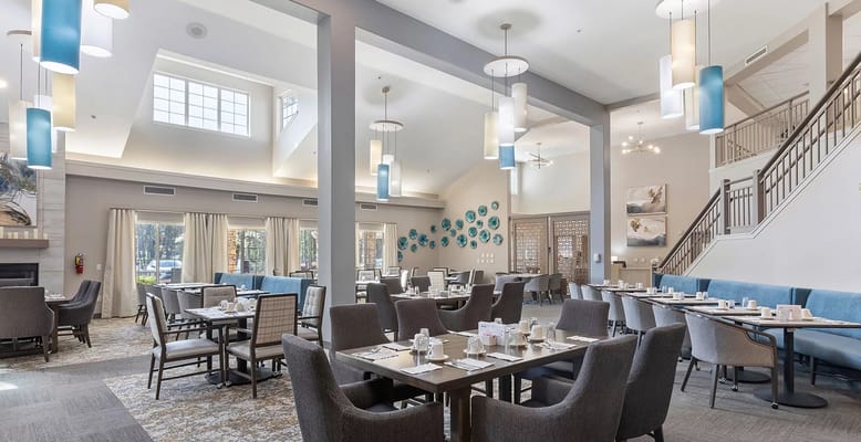 Bright dining room setup with tables and chairs