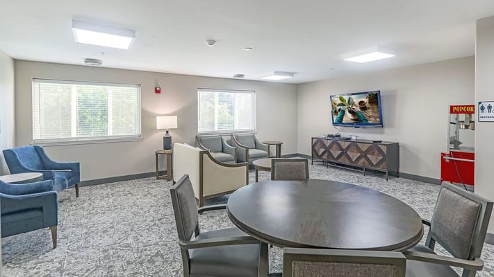 Cozy lounge area with seating and TV