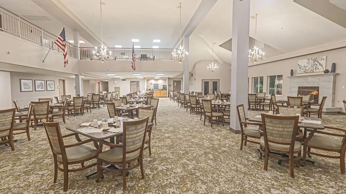 Elegant dining area with tables set for residents