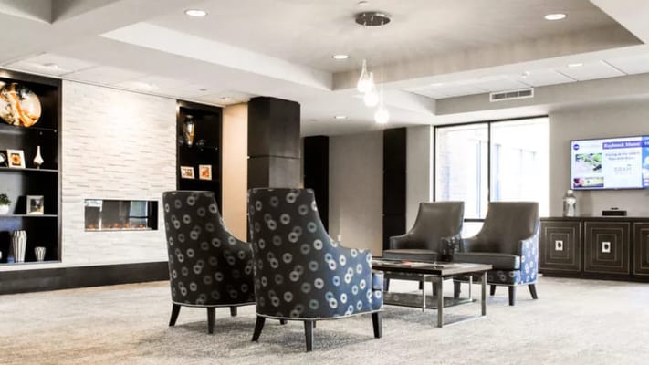 Interior common area with chairs and fireplace