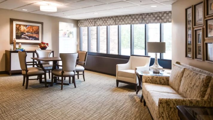 Bright common area with seating and artwork