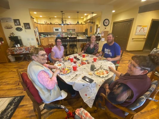 Residents enjoying a meal together in the dining area