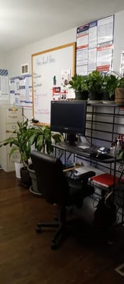 Comfortable office space with plants and computer at Home Sweet Home facility