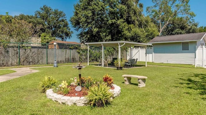 Outdoor garden area with seating and landscaping