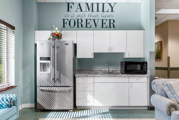 Bright kitchen area with family-themed decor