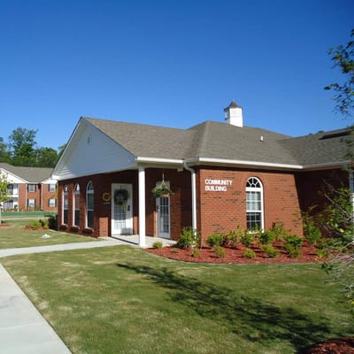 Exterior view of the community building at Hummingbird Pointe