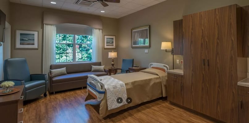 A comfortable private resident room with natural light