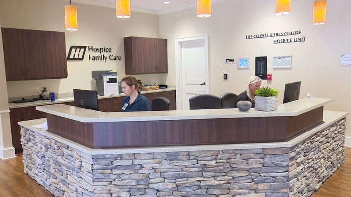 Reception area with staff at a hospice facility