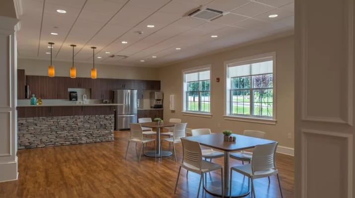 Bright common area with tables and seating