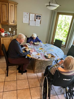 Residents enjoying a meal together in a dining area