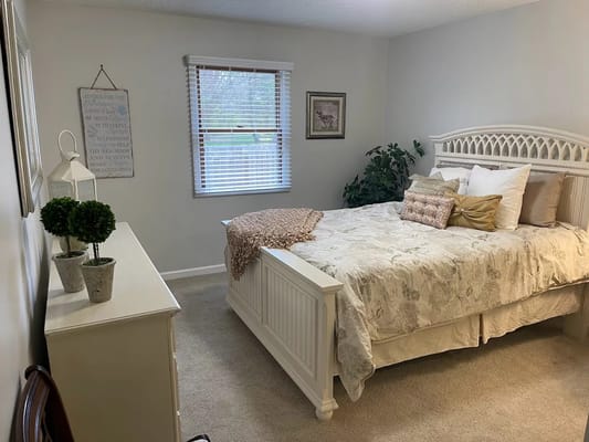 Cozy interior of a resident's room with light decor