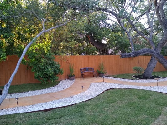 Serene outdoor garden space with a bench and pathway