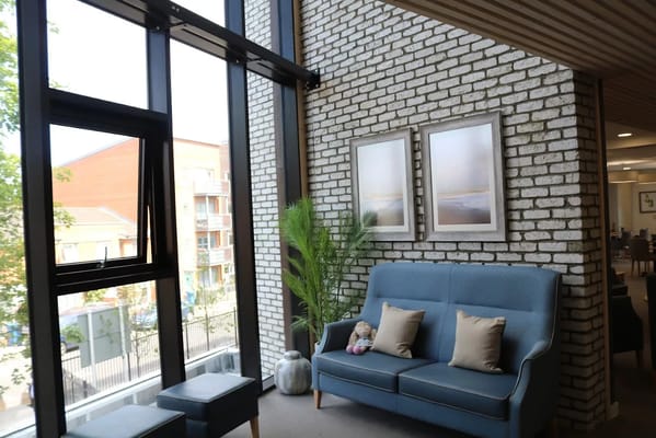 Bright common area with seating and natural light