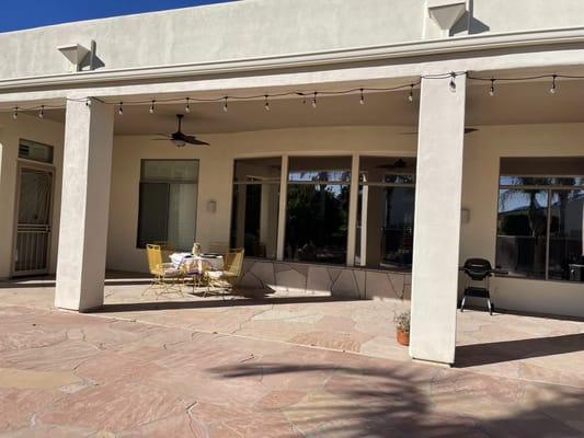 Outdoor patio with seating and shade