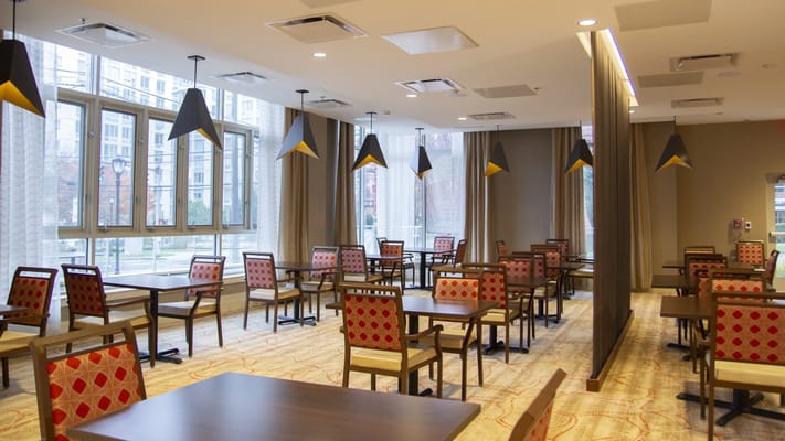 Bright dining room with chairs and tables