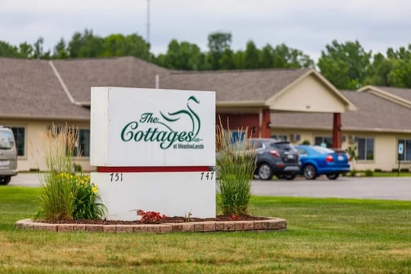 Exterior sign of The Cottages at Meadowlands