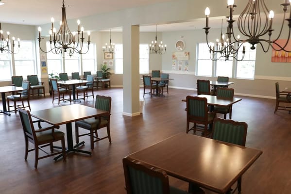 Bright dining room with wooden tables and chairs