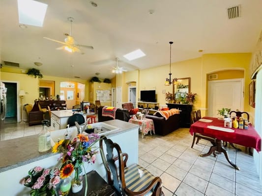 Bright common area with seating and floral decorations