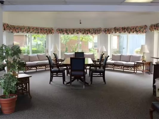 Bright common area with seating and natural light