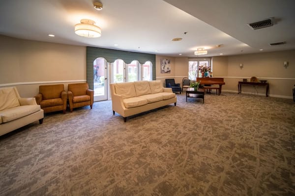 Bright common area with seating and natural light