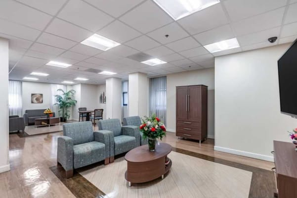 A bright common area with seating and decor