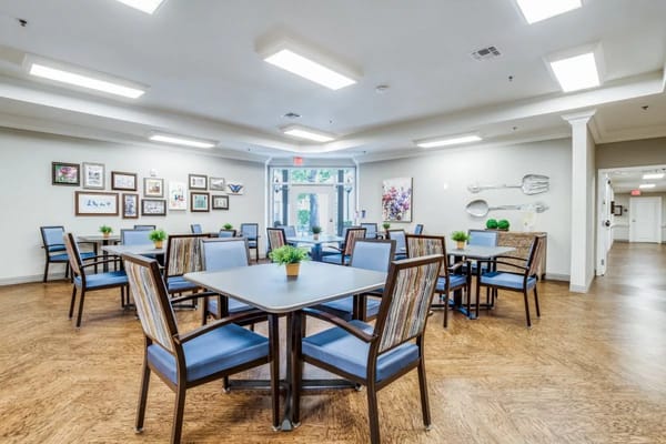 Bright dining area with tables and chairs