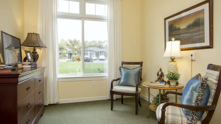 Well-furnished interior corner with a window view