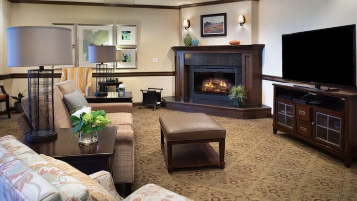 Cozy common area with a fireplace and seating