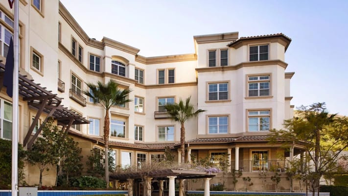 Exterior view of Ivy Park at Palos Verdes with palm trees