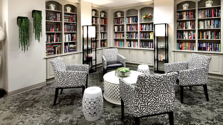 Cozy library corner with bookshelves and seating