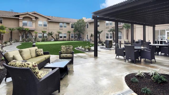 Outdoor area with seating and green space