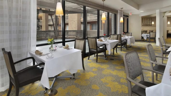 Bright dining area with tables set for meals