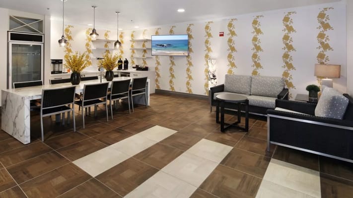 Bright common area with dining and seating arrangements