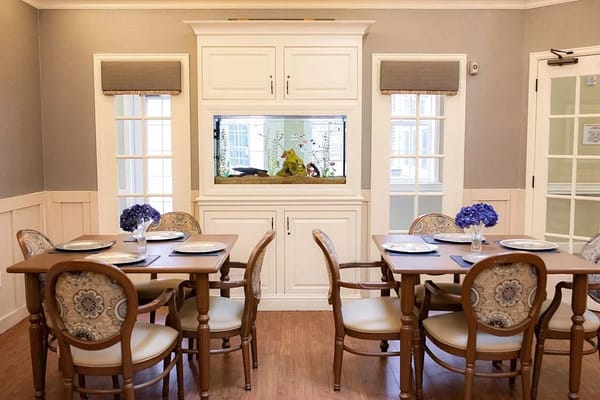 Dining area with tables set for residents