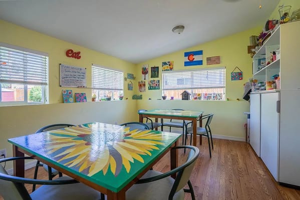 Bright dining area with colorful tables and decorations