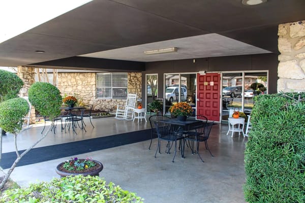 View of the entrance area with seating and landscaping at Jeffrey Place Healthcare Center.