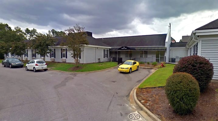 Exterior view of the assisted living facility with parking