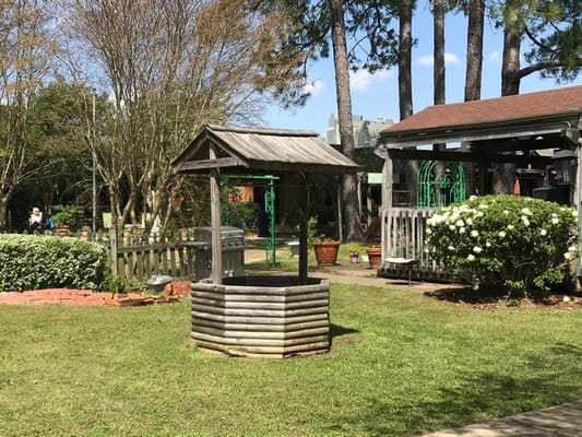 Outdoor garden space with gazebo and well
