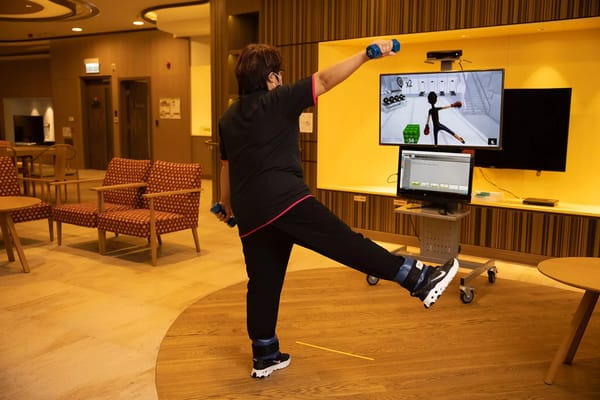 Staff member participating in an activity in a common area