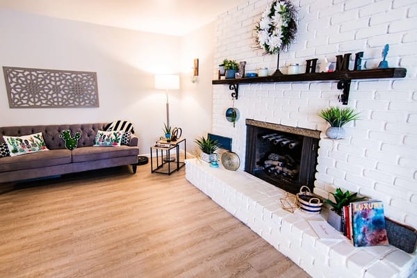Cozy common area with a sofa and fireplace