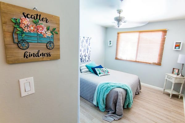 A cozy resident room with bright decor and a bed