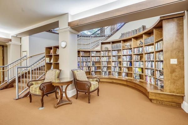 Comfortable seating area with bookshelves in a library